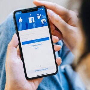 Chiang Mai Thailand. NOV  28, 2021. Woman holds  smart phone with facebook application on the screen. facebook is a photo-sharing app for smartphones