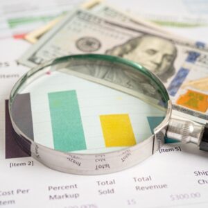 Magnifying glass on graph paper. Financial development, Banking Account, Statistics, Investment Analytic research data economy, Business concept.