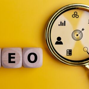SEO Search Engine Optimization on wooden cubes with magnifying glass. Website Internet Business Technology Concept.